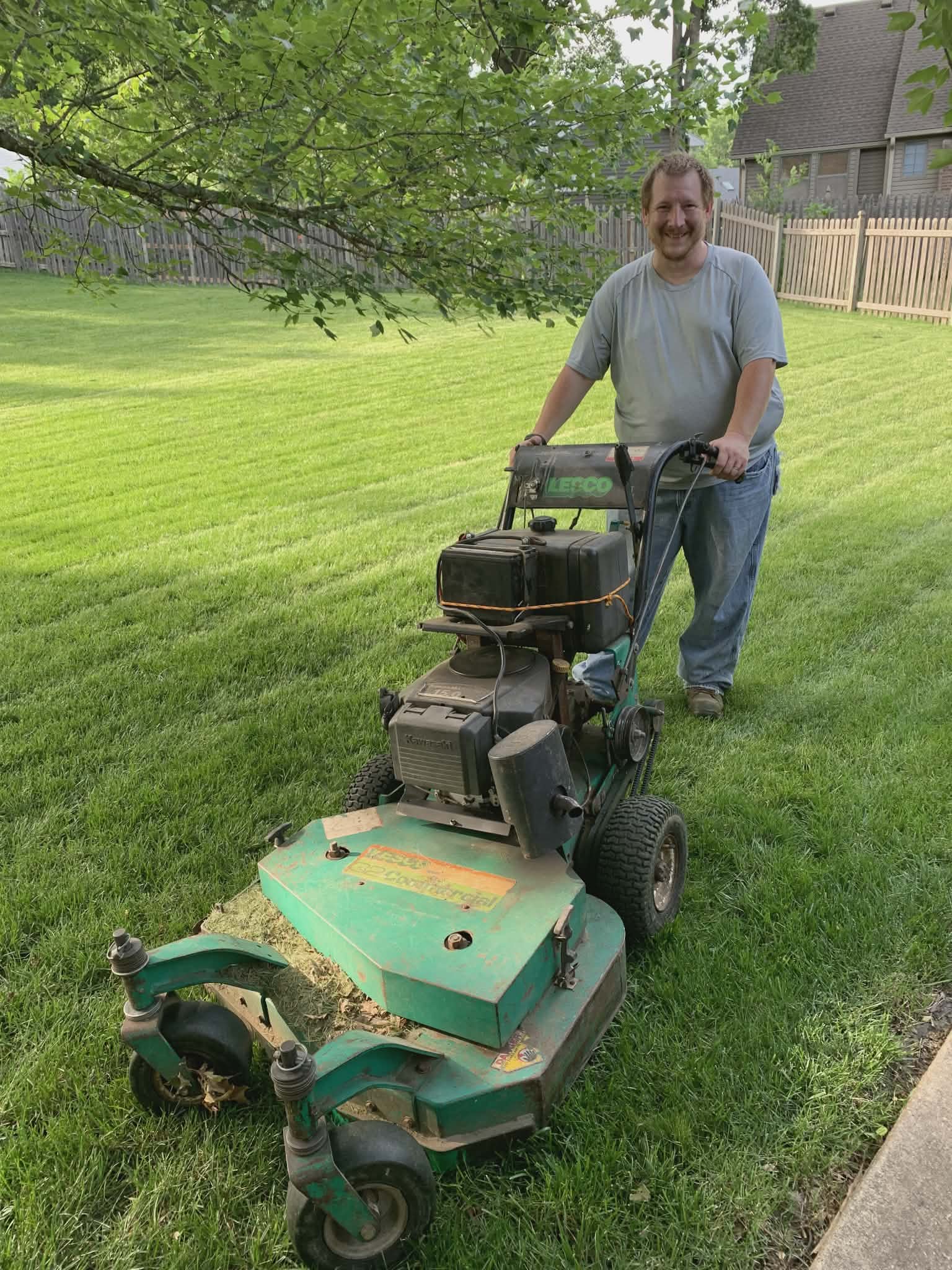 Dad mowing a lawn